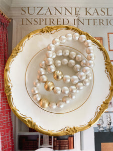 Olivia Cotton Pearl & Gold Bracelet displayed on gold accented china dish_m donohue collection