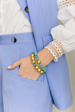 Load image into Gallery viewer, Model is wearing Pamela Gold &amp; Aqua Bracelet_m donohue collection