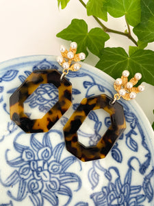 Riley Tortoise Earrings displayed on blue porcelain dish_m donohue collection